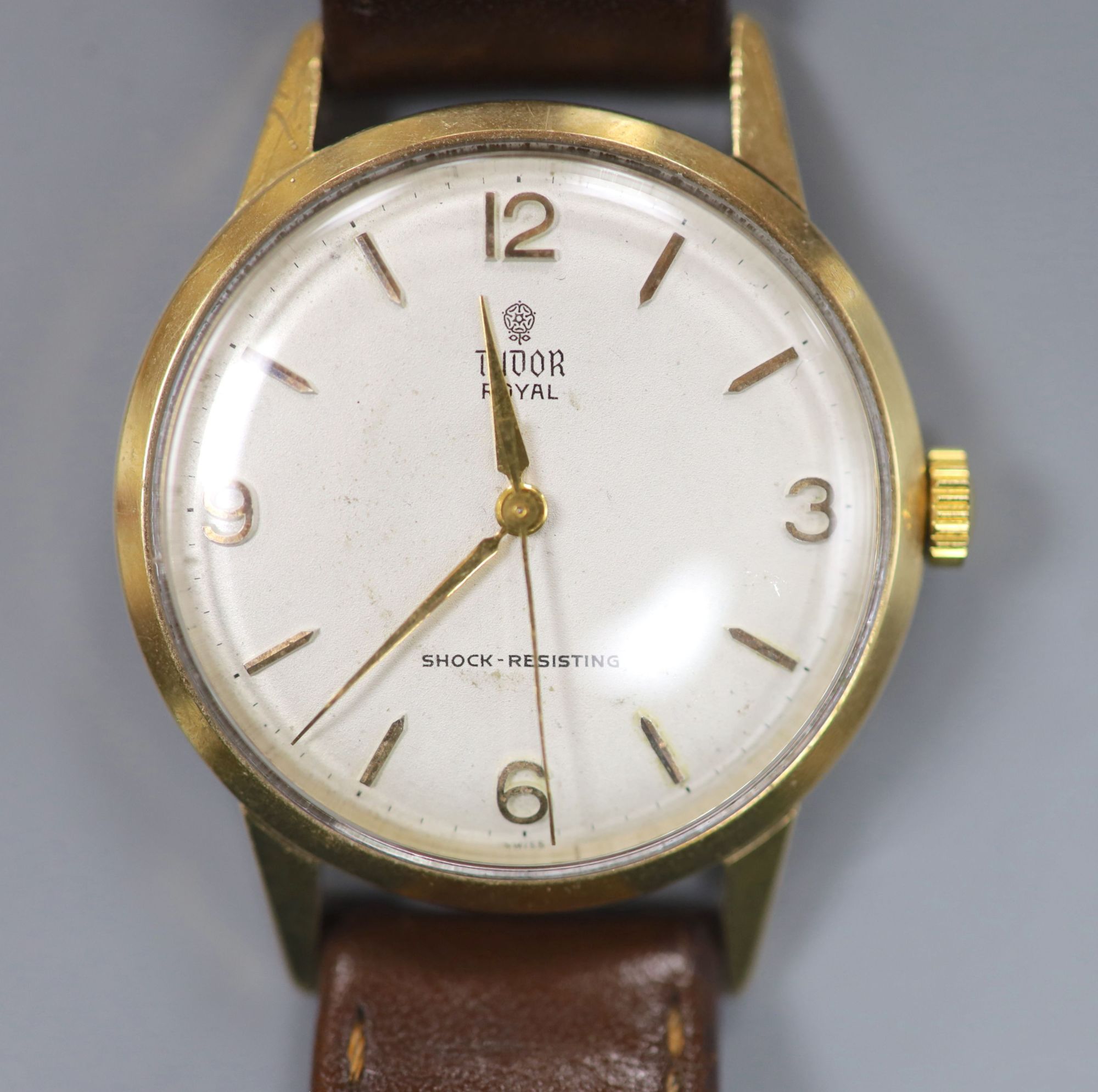 A gentlemans early 1960s 9ct gold Tudor Royal manual wind wrist watch, on associated leather strap,